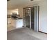 Living space overlooking kitchen area, complete with white cabinets and plenty of light at 3152 Clewiston St, Deltona, FL 32738