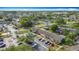 Aerial view of the community featuring well-maintained landscaping, ample parking, and proximity to a community lake at 3208 W Tower Ct, Kissimmee, FL 34741