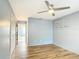A light blue bedroom features a ceiling fan and closet at 3208 W Tower Ct, Kissimmee, FL 34741