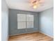 Bedroom with a ceiling fan and view of the outside at 3208 W Tower Ct, Kissimmee, FL 34741