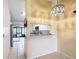 Bright and airy kitchen view showcases an open design, providing a clear sightline to a serene outdoor patio space at 3208 W Tower Ct, Kissimmee, FL 34741