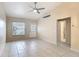 Open-concept living space featuring tile floors, a ceiling fan, and a seamless transition to other areas of the home at 3208 W Tower Ct, Kissimmee, FL 34741