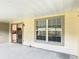 Outdoor patio with sliding door access to kitchen area and a large window allowing plenty of natural light at 3208 W Tower Ct, Kissimmee, FL 34741