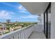 White railed balcony overlooking a cityscape, a tranquil outdoor space for relaxation and enjoyment at 400 E Colonial Dr # 1202, Orlando, FL 32803
