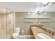 Bathroom featuring double sinks, vanity mirror, shower, and ample counter space at 400 E Colonial Dr # 1202, Orlando, FL 32803