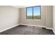 Bright bedroom features a large window offering beautiful views and plenty of natural light at 400 E Colonial Dr # 1202, Orlando, FL 32803