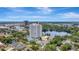 Beautiful exterior view of a high rise condo with pool surrounded by lush greenery at 400 E Colonial Dr # 1202, Orlando, FL 32803