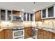 Updated kitchen with stainless steel appliances, stylish cabinets and neutral countertops at 400 E Colonial Dr # 1202, Orlando, FL 32803