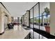Grand lobby entrance with floor-to-ceiling windows, stylish seating, and a welcoming atmosphere for residents and guests at 400 E Colonial Dr # 1202, Orlando, FL 32803