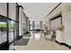Spacious lobby entrance featuring modern tile flooring, stone accents, and floor-to-ceiling windows for ample natural light at 400 E Colonial Dr # 1202, Orlando, FL 32803