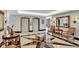 Welcoming lobby area with elevator access, decorative mirrors, and comfortable seating for residents and guests at 400 E Colonial Dr # 1202, Orlando, FL 32803