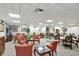 Relaxing meeting room with couches, tables, and chairs for residents to enjoy events or small get-togethers at 400 E Colonial Dr # 1202, Orlando, FL 32803