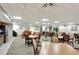 Spacious meeting room with tables, chairs, couches, and a kitchenette providing a perfect spot for residents to enjoy company at 400 E Colonial Dr # 1202, Orlando, FL 32803