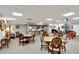 Comfortable meeting room with tables, chairs, and a small kitchen area to allow tenants to enjoy events and get-togethers at 400 E Colonial Dr # 1202, Orlando, FL 32803