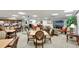 Relaxing meeting room with couches, tables, and chairs for residents to enjoy events or small get-togethers at 400 E Colonial Dr # 1202, Orlando, FL 32803