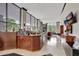 Modern lobby with a wooden reception desk, sleek flooring, and large windows offering scenic views at 400 E Colonial Dr # 1202, Orlando, FL 32803
