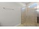 Bathroom featuring tiled shower with glass doors at 405 E Freesia Ct, Deland, FL 32724