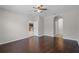 Bedroom features hardwood floors, neutral paint and an archway at 405 E Freesia Ct, Deland, FL 32724