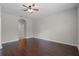 Bedroom features hardwood floors, neutral paint and an archway at 405 E Freesia Ct, Deland, FL 32724