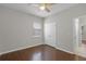 Bedroom showcasing hardwood floors and a ceiling fan at 405 E Freesia Ct, Deland, FL 32724