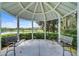 Scenic gazebo offers views of a tranquil lake surrounded by lush greenery at 405 E Freesia Ct, Deland, FL 32724