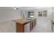Open kitchen view, showcasing granite countertops and modern appliances at 405 E Freesia Ct, Deland, FL 32724