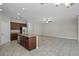 Spacious kitchen with stainless steel appliances, granite counters and tile floors at 405 E Freesia Ct, Deland, FL 32724