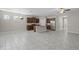 Open floor plan showcasing the dining area, and kitchen with stainless steel appliances and a center island at 405 E Freesia Ct, Deland, FL 32724
