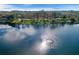 Scenic aerial view of a peaceful lake within the community and lush green surroundings at 405 E Freesia Ct, Deland, FL 32724