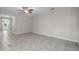 Spacious living room featuring modern tile flooring, neutral paint, and great natural light at 405 E Freesia Ct, Deland, FL 32724