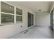 Covered patio with a screened enclosure features access via sliding glass doors at 405 E Freesia Ct, Deland, FL 32724