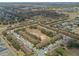 Panoramic aerial view showcasing a well-planned residential community with mature trees at 4143 Calabria Ave, Davenport, FL 33897
