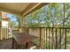 Enjoy the outdoors on this balcony with a beautiful view and wood-style flooring at 4143 Calabria Ave, Davenport, FL 33897