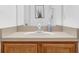 Bathroom vanity with wood cabinets, light countertop, and mirror with natural light at 4143 Calabria Ave, Davenport, FL 33897