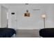 Bright bedroom featuring two twin beds with white walls and a mounted flatscreen television at 4143 Calabria Ave, Davenport, FL 33897