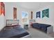 Charming bedroom featuring two twin beds with unique Harry Potter themed decor and grey furnishings at 4143 Calabria Ave, Davenport, FL 33897