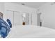 Bright bedroom with white walls, closet doors, and carpet flooring at 4143 Calabria Ave, Davenport, FL 33897