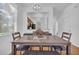 A dining room features a dining table with chairs, benches, and overhead lighting at 4143 Calabria Ave, Davenport, FL 33897