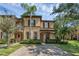 Charming two-story home with a well-manicured lawn and inviting curb appeal at 4143 Calabria Ave, Davenport, FL 33897