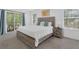 Bright bedroom with a large bed, sliding glass doors, and natural light at 4143 Calabria Ave, Davenport, FL 33897