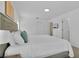 Spacious bedroom with a large bed, neutral decor, and access to ensuite bath at 4143 Calabria Ave, Davenport, FL 33897