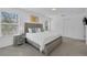 Bright bedroom with a large bed, a nightstand, and lots of natural light at 4143 Calabria Ave, Davenport, FL 33897