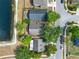 Birds eye view of the community pond surrounded by lush greenery and residential homes at 4406 Brookstone Ct, Orlando, FL 32826