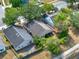 Overhead view of the home with mature trees, the backyard, and surrounding neighborhood at 4406 Brookstone Ct, Orlando, FL 32826