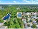 Expansive aerial perspective featuring neighborhood ponds, lush trees, and beautiful homes at 4406 Brookstone Ct, Orlando, FL 32826