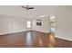 Spacious living room with vaulted ceiling, wood flooring, and an open floor plan at 4406 Brookstone Ct, Orlando, FL 32826