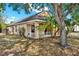 Side view of single Gathering home featuring mature landscaping and a fenced yard at 4406 Brookstone Ct, Orlando, FL 32826