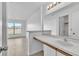 Bathroom vanity with a large mirror, providing access to bedroom and bath, ideal for guests at 46 Silver Falls Cir, Kissimmee, FL 34743