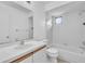 Clean bathroom featuring a white tiled shower, tub, and updated vanity at 46 Silver Falls Cir, Kissimmee, FL 34743