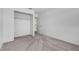 Bedroom features plush carpeting, closet, and neutral color scheme at 46 Silver Falls Cir, Kissimmee, FL 34743